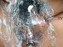 Close-up view of Indian girl's shaved pussy in the bathroom