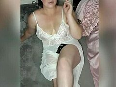 Solo female in white indulges in smoking fetish