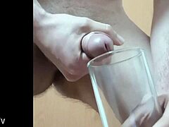 Gay twink enjoys a cup of cum in solo video