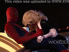 Sultry seductress in latex costume gives a blowjob to Spiderman
