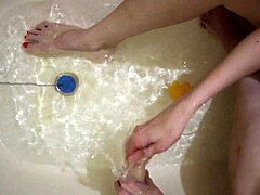 Steamy footjob and toy play on bare feet in the bath