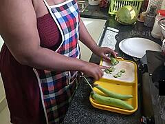 My girlfriend enjoys eating brinjal while alone in the kitchen