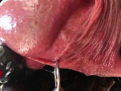 Intense POV of latex-clad amateur indulging in peehole play and satisfying climax